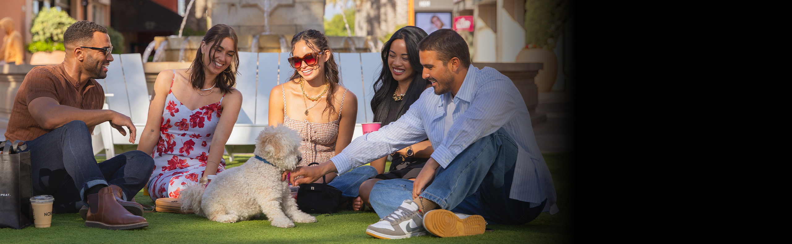 Group of friends sitting on the Giant Wheel Lawn